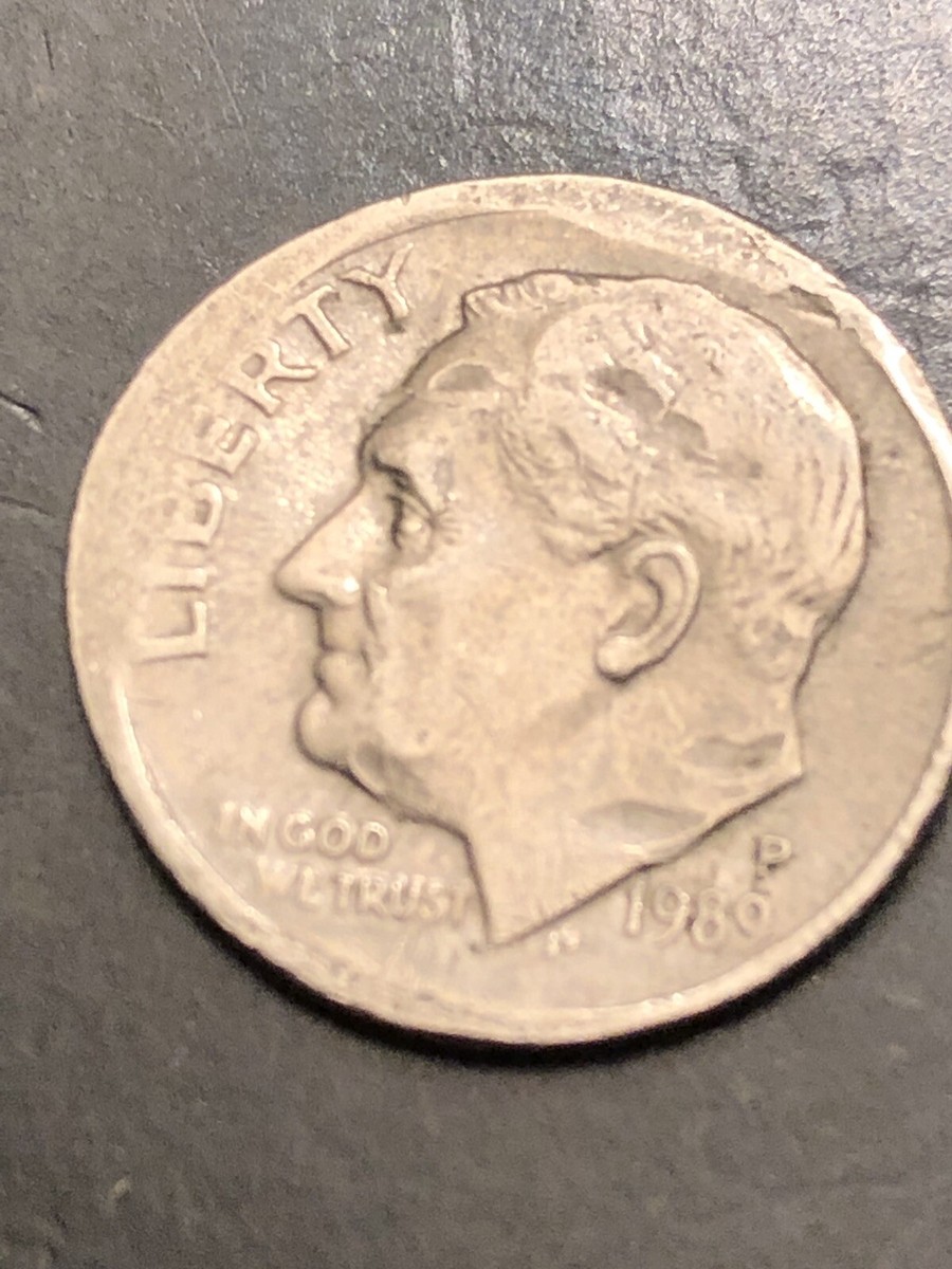 1989 dime off-center strike error showing partial design and blank unstruck area on the opposite side of the coin