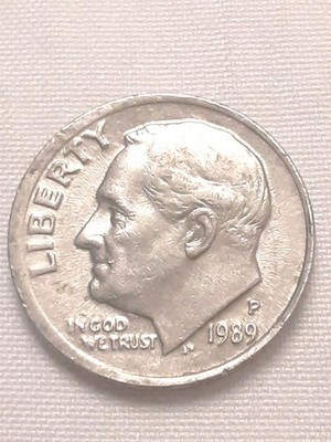 1989 dime repunched mint mark error showing doubled P or D impression under magnification with shadow or extra serif visible